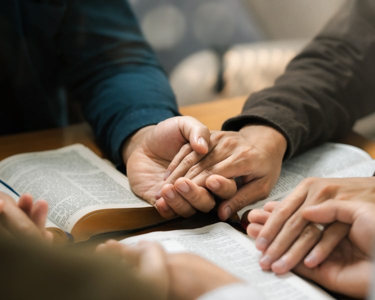 Group,Of,Young,Christians,Praying,,Holding,Hands,And,Praying,Together