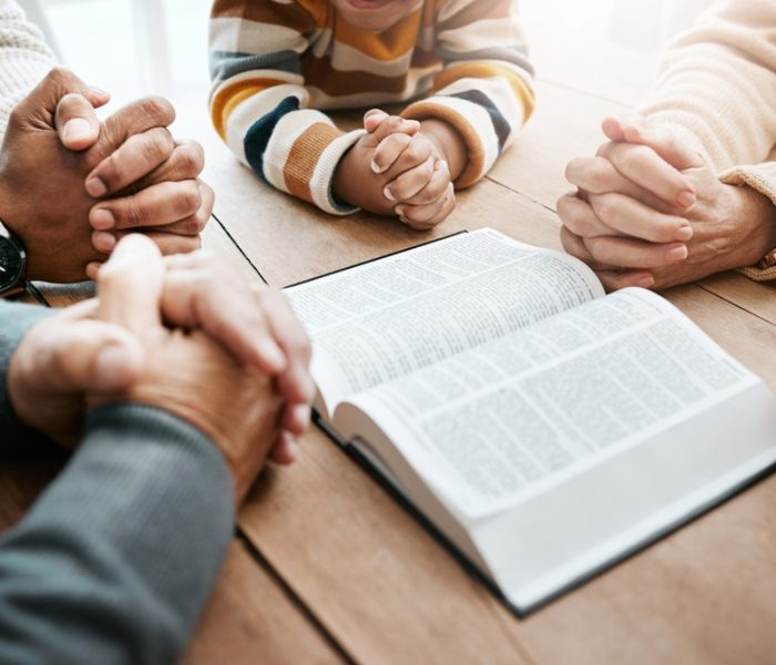 Bible,,Reading,Book,Or,Hands,Of,Big,Family,In,Prayer,